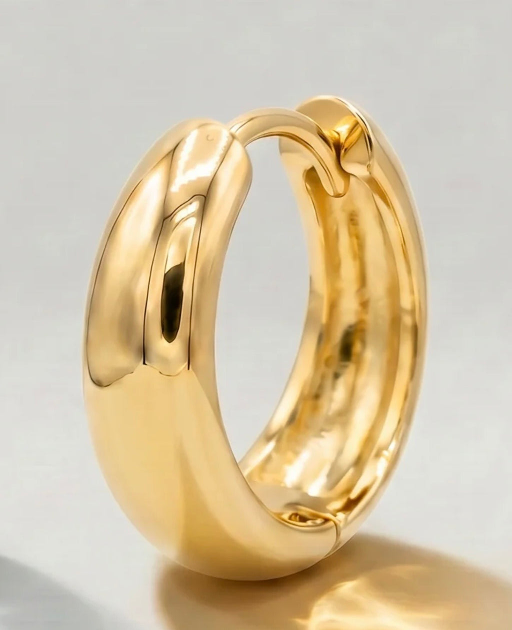 18k gold plated huggie hoop close-up
