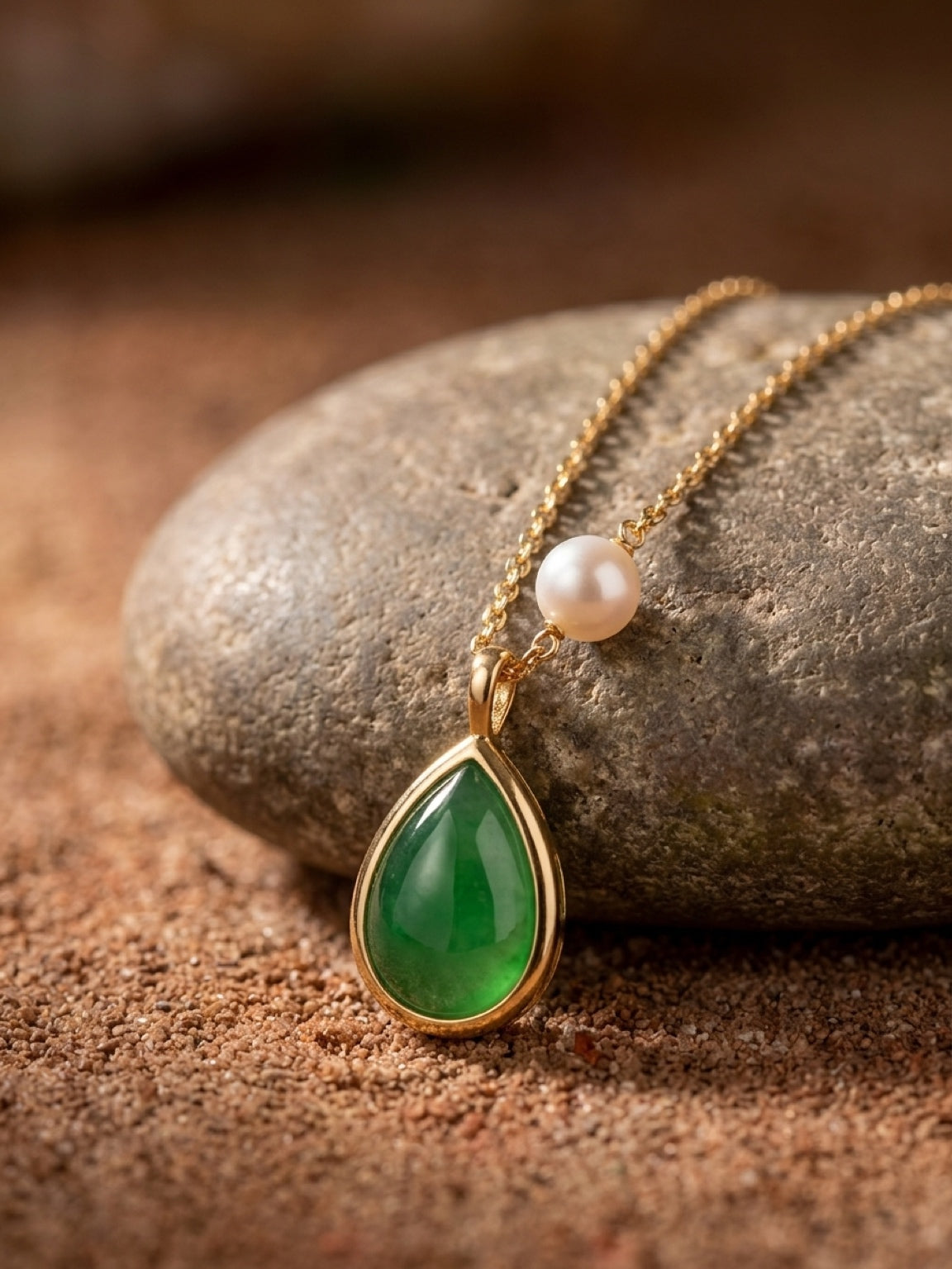 Close detail of natural green onyx pendant and pearl necklace